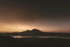 Beautiful sunrise with views of the lake and Mount Batur, Bali